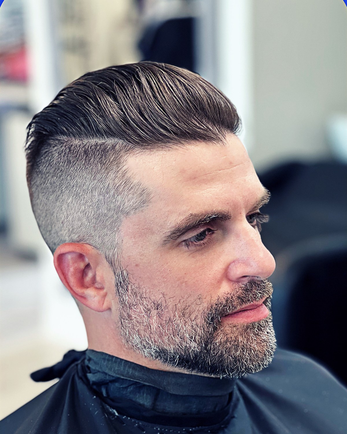 Side part fade haircut by Erik Bello